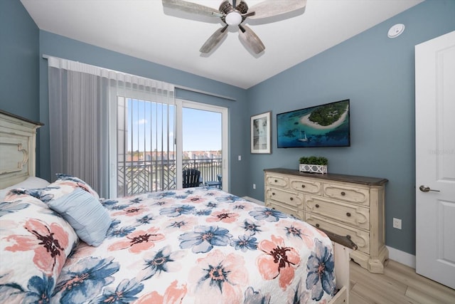 bedroom featuring access to exterior, light wood-type flooring, and ceiling fan