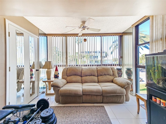 tiled living room with ceiling fan