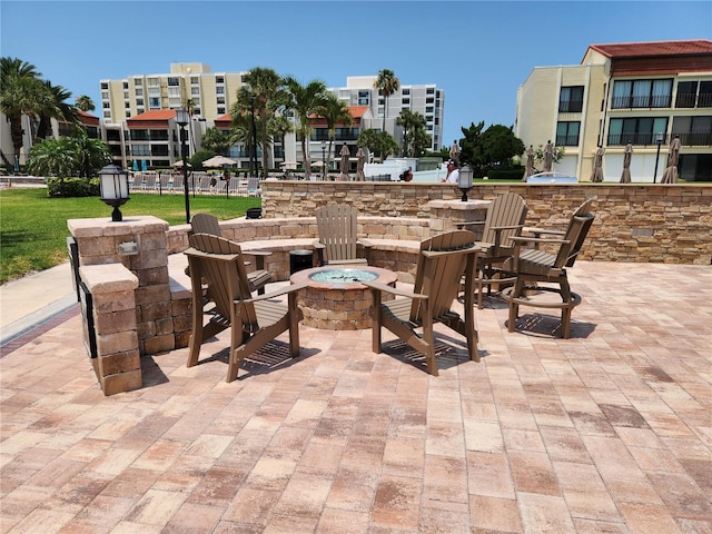 view of patio with a fire pit