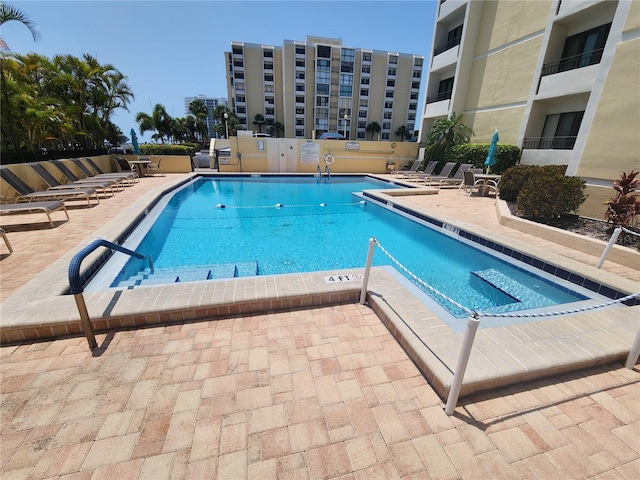 view of swimming pool with a patio