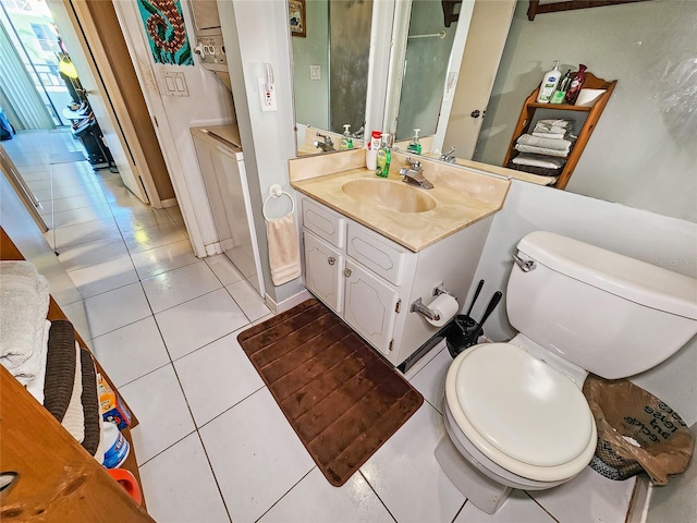 bathroom with tile patterned floors, vanity, and toilet