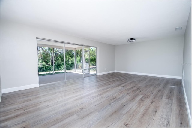 spare room featuring light hardwood / wood-style flooring