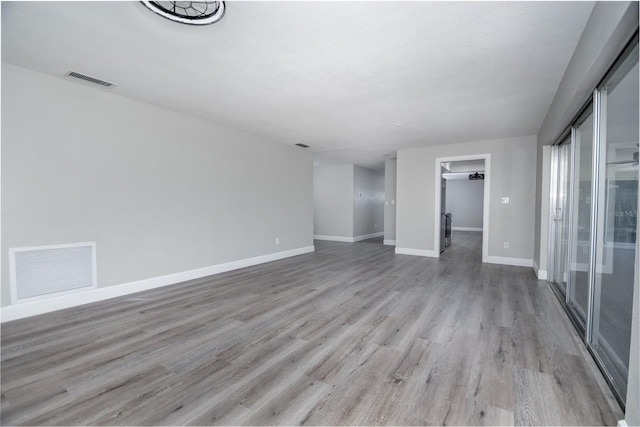 spare room with light hardwood / wood-style floors