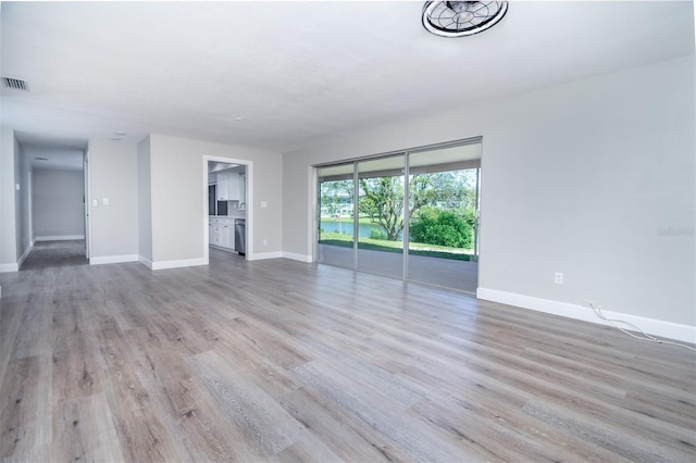 unfurnished living room featuring light wood-type flooring