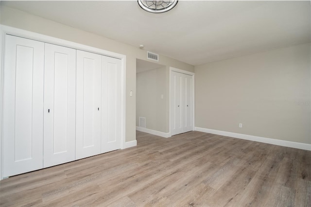 unfurnished bedroom featuring light hardwood / wood-style flooring