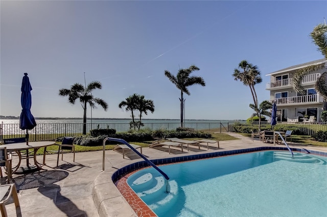 view of swimming pool with a patio