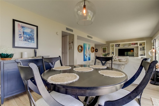 dining room with light hardwood / wood-style flooring