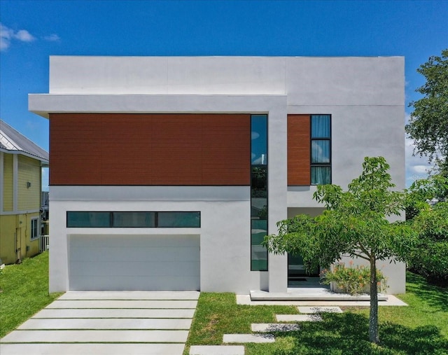 modern home with a garage and a front yard