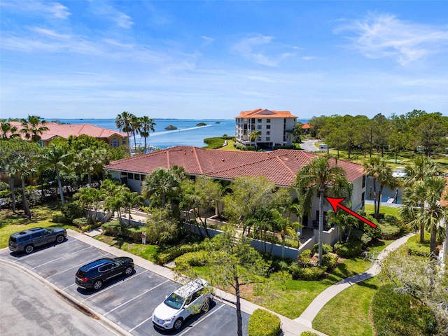 birds eye view of property with a water view