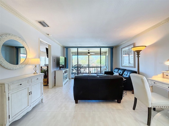 living room with a textured ceiling, crown molding, and light tile floors