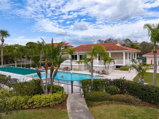 view of swimming pool featuring a patio area