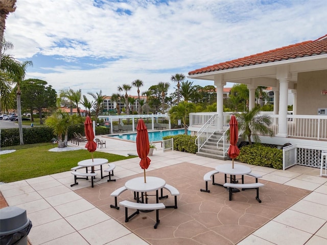 view of patio featuring a community pool