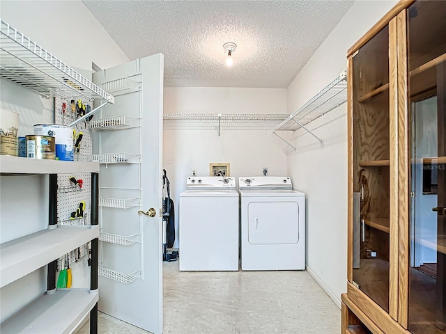 laundry room featuring hookup for an electric dryer, washing machine and dryer, hookup for a washing machine, and a textured ceiling