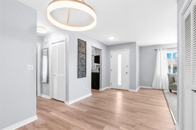 foyer with light wood-type flooring