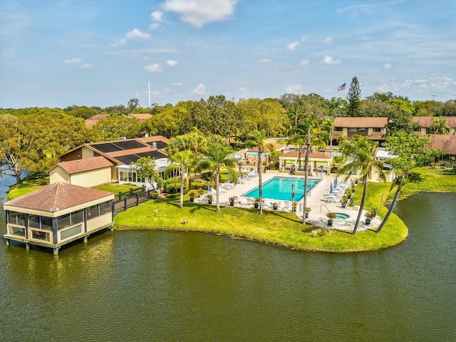 birds eye view of property with a water view