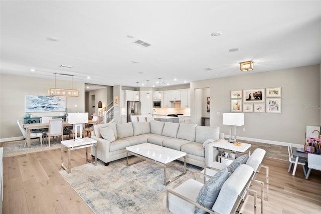 living room with light hardwood / wood-style flooring