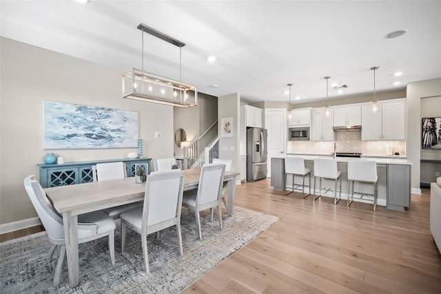 dining area with light hardwood / wood-style floors