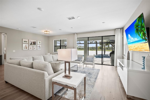 living room with light hardwood / wood-style flooring