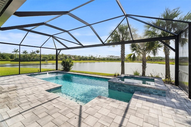 view of pool with a patio, a lanai, and an in ground hot tub