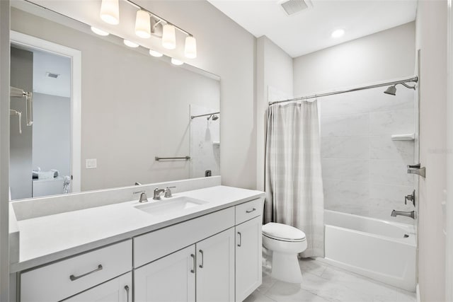 full bathroom with tile floors, shower / tub combo, vanity, and toilet