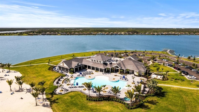 birds eye view of property with a water view