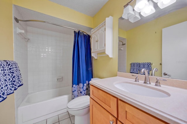 full bathroom with large vanity, toilet, tile flooring, shower / tub combo with curtain, and a textured ceiling