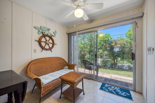 living area featuring ceiling fan and light tile floors