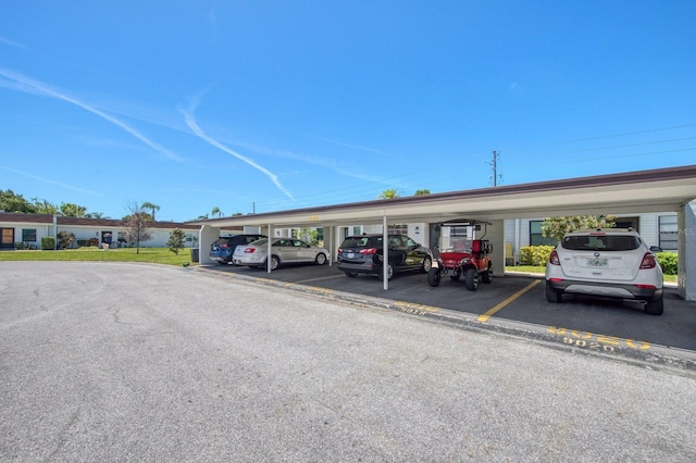 view of vehicle parking with a carport