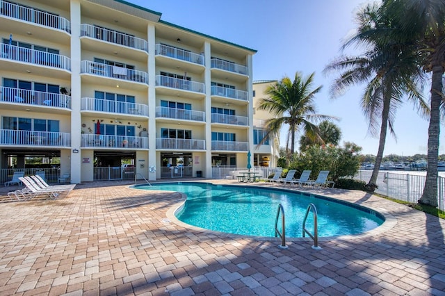 view of swimming pool with a patio area