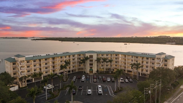 outdoor building at dusk featuring a water view