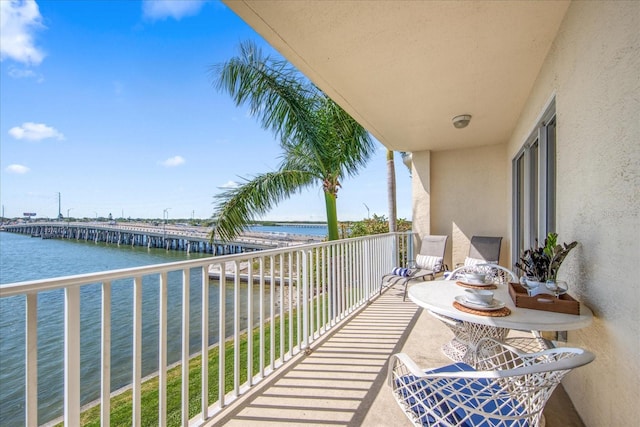 balcony featuring a water view