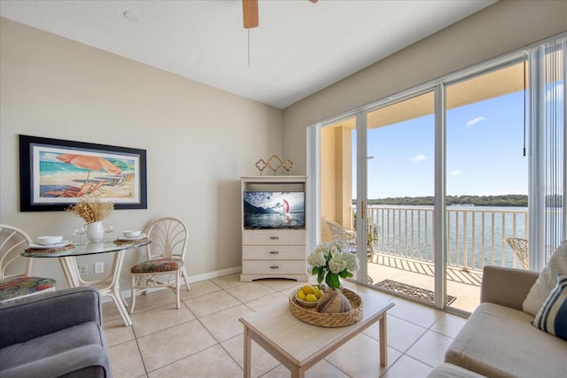 tiled living room featuring ceiling fan