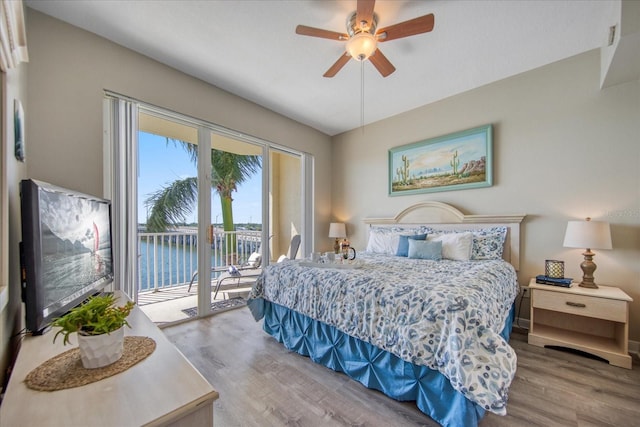 bedroom featuring access to outside, ceiling fan, and hardwood / wood-style flooring