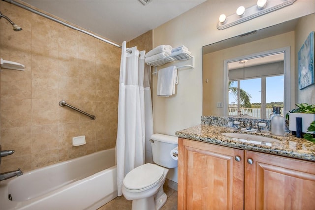 full bathroom with shower / bath combo, vanity, toilet, and tile patterned floors