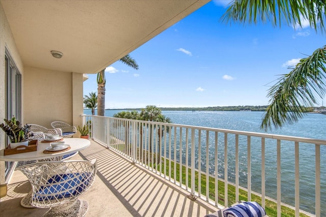 balcony featuring a water view