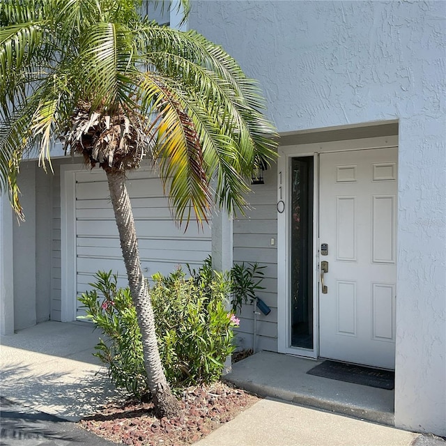 property entrance with a garage