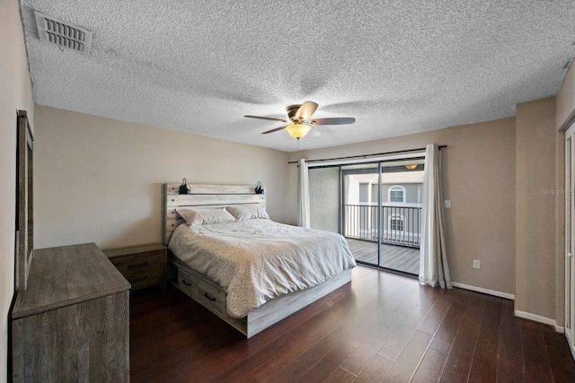 bedroom with ceiling fan, access to exterior, dark hardwood / wood-style floors, and a textured ceiling