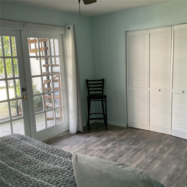 bedroom featuring french doors, ceiling fan, access to outside, dark hardwood / wood-style floors, and a closet