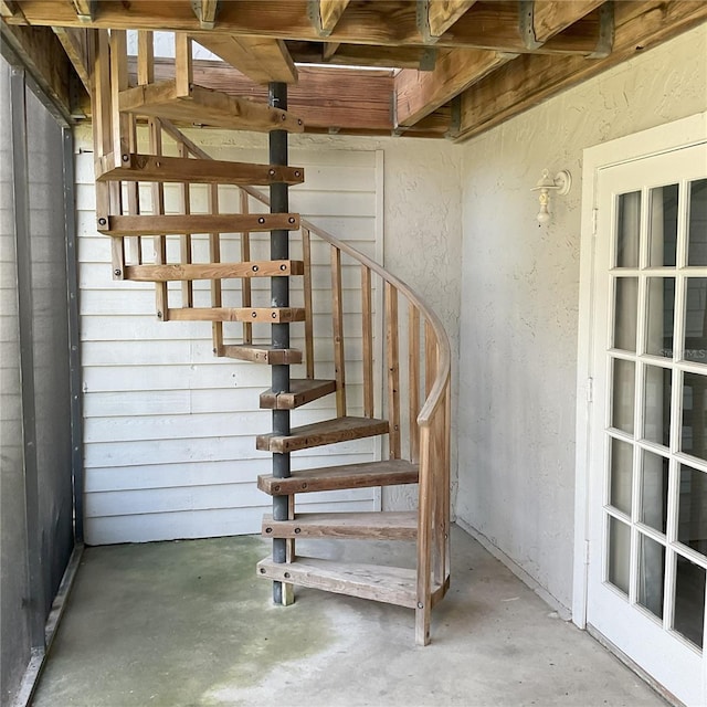 stairs with concrete floors