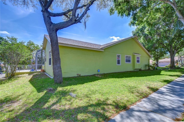 view of property exterior with a lawn