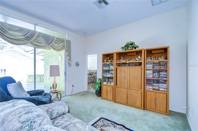 living room featuring light carpet