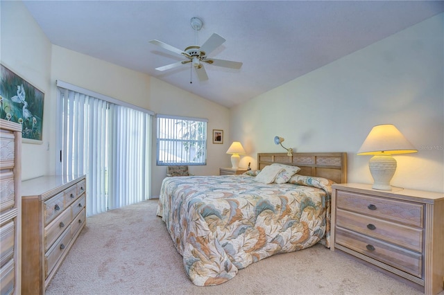 carpeted bedroom with vaulted ceiling and ceiling fan