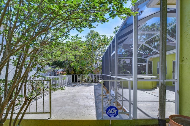 view of patio with a lanai