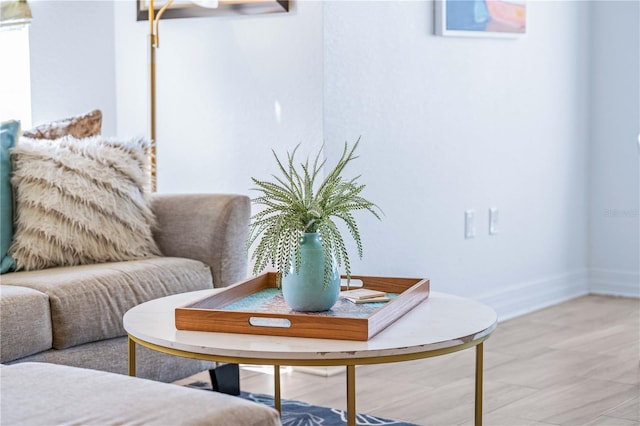 living area with hardwood / wood-style flooring