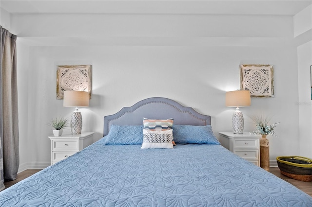 bedroom with wood-type flooring