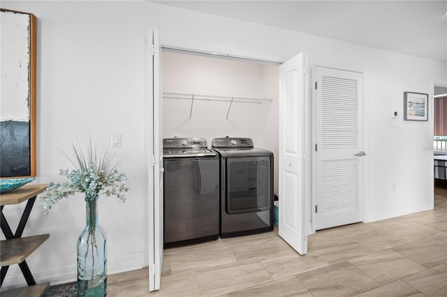 washroom with independent washer and dryer and light tile floors