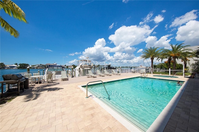 view of swimming pool with a patio area