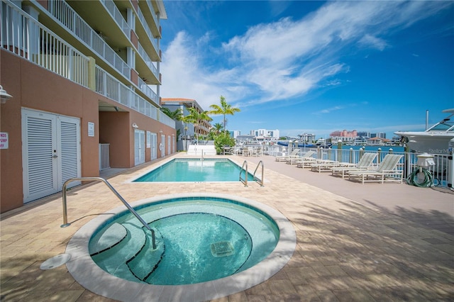 view of pool featuring a community hot tub