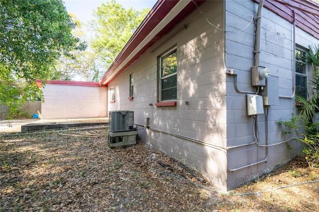 view of side of property with cooling unit