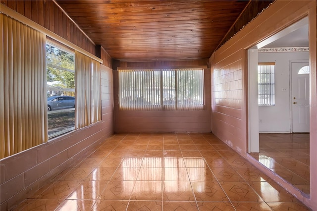 unfurnished sunroom featuring wooden ceiling